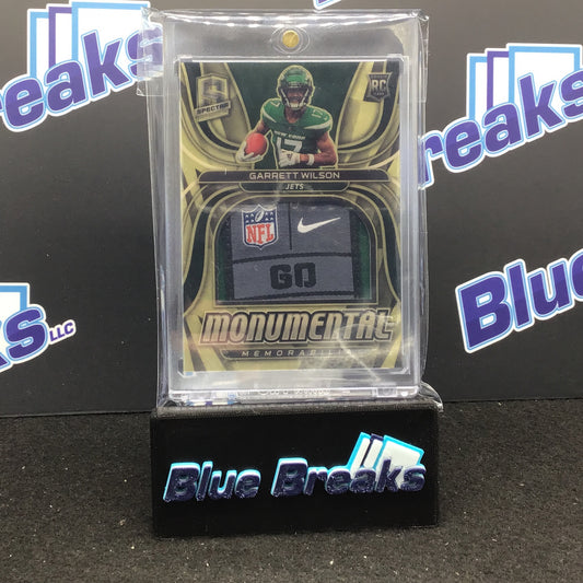 2022 Panini - Spectra - Garrett Wilson - Monumental Memorabilia - Nike Swoosh - Tag - New York Jets - 1/1